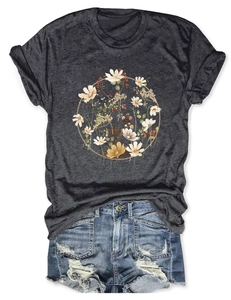 Detail of floral wreath print on charcoal t-shirt paired with distressed denim shorts