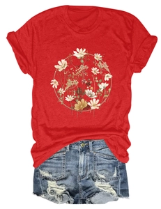 Close-up of red cotton T-shirt with floral wreath print and distressed denim shorts