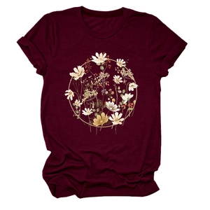 Close-up of circular floral artwork print on wine red short sleeve t-shirt for women