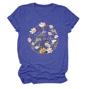 Detail of blue heather T-shirt featuring a floral wreath print with daisies and berries