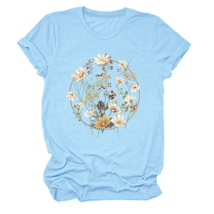 Detail of light blue t-shirt featuring a vintage floral wreath print on soft cotton fabric