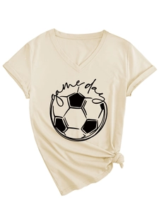 Detail of V-neck T-shirt showing game day football graphic and stylish side knot hem