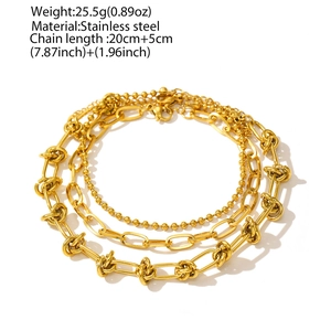 Detailed view of triple-layered stainless steel chain bracelet with knot design