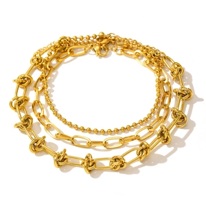 Three-piece gold stainless steel hip hop chain bracelet set featuring knotted punk styles