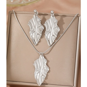 Silver leaf necklace and earrings set with pleated texture on silk fabric