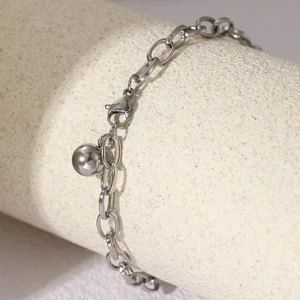Minimalist stainless steel chain bracelet with solid ball charm and lobster clasp