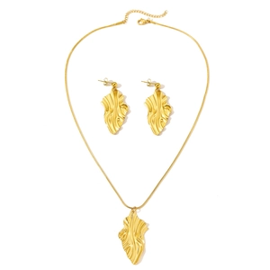 Golden stainless steel jewelry set featuring wrinkled leaf pendant and matching earrings