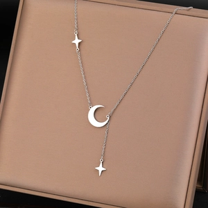 Minimalist stainless steel moon and star tassel necklace with polished silver finish
