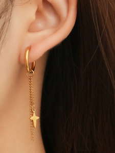 Close-up of 18k gold plated stainless steel hoop earrings with star charm drop chains