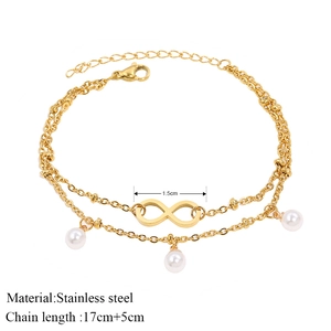 Double-layer stainless steel infinity bracelet with white pearls and adjustable gold chain