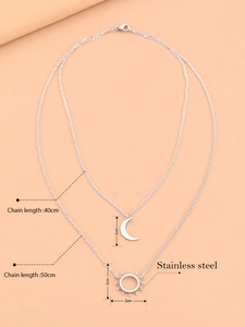 Detail view of double-layer stainless steel necklace with sun and moon pendants and dimensions