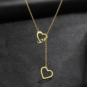 Punk style golden double heart pendant necklace with love lettering on black background