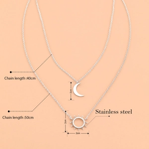 Double-layered stainless steel necklace featuring sun and moon pendants in silver finish