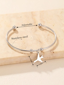 Detailed view of silver stainless steel adjustable bangle with plane charm and dimensions