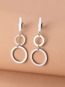 Detail of silver geometric drop earrings featuring a sleek rectangular stud and dual rings