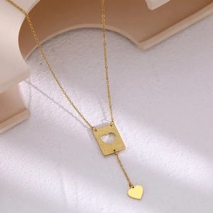 Elegant gold double heart necklace with frosted rectangular pendant and polished heart charm