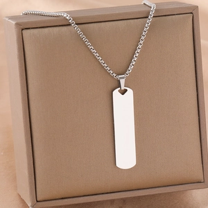 Polished stainless steel rectangular pendant with heart cutout on a classic box chain