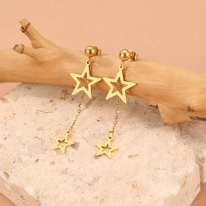 Boucles d'oreilles étoiles dorées avec pampilles sur branche et socle en pierre