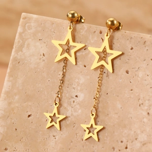 Boucles d'oreilles étoiles dorées en acier inoxydable sur support minéral