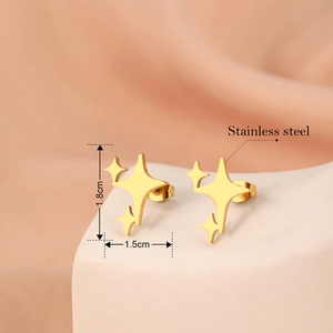 Gold stainless steel star stud earrings featuring minimalist triple starburst design