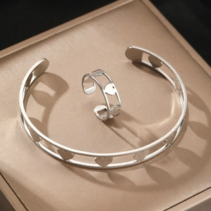 Adjustable silver heart-shaped stainless steel cuff bracelet and ring set for couples