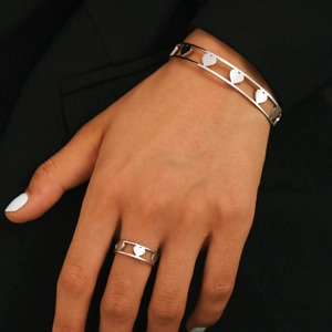 Polished silver heart cut-out stainless steel ring and open bracelet jewelry set