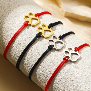 Braided pet paw bracelets in red and black colors with adjustable metal charm cords