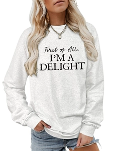 Detail of First of All I'm a Delight text on heather white crewneck sweatshirt