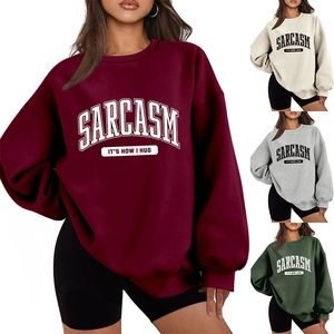 Detail showing oversized sweatshirts in burgundy, beige, grey and dark green colors
