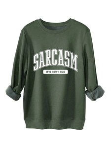 Detail of dark green sweatshirt showing gray fleece lining and ribbed cuffs for warmth