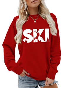 Detail of red crewneck sweatshirt featuring white SKI mountain silhouette print