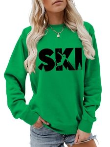 Detail of green crewneck sweatshirt featuring black SKI lettering and ribbed cuffs