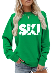 Detail of green SKI sweatshirt showing cotton texture and athlete silhouette print