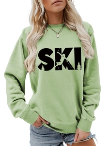 Detail of ribbed cuffs and creative SKI lettering on mint green long sleeve sweatshirt