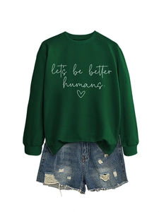 Detail of green crewneck sweatshirt featuring white let's be better humans print