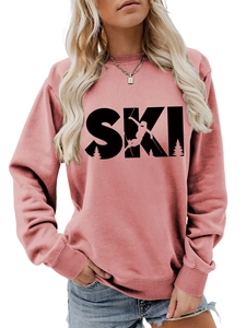 Detail of dusty pink ski sweatshirt featuring rib-knit cuffs and graphic print
