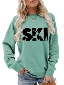 Detail view of the SKI logo and skier graphic on this mint green long-sleeved sweatshirt