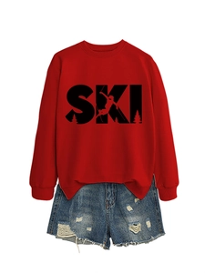 Flat lay of red SKI graphic sweatshirt with denim shorts on a plain white backdrop