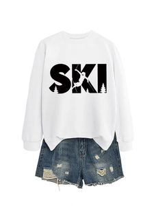 Detailed view of the white SKI sweatshirt featuring ribbed cuffs and winter mountain graphic