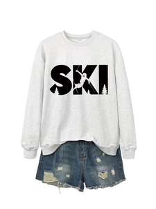 Detail of grey SKI sweatshirt and distressed denim shorts set with print and S size tag