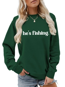 Detail view of forest green crewneck sweatshirt with white he's fishing slogan print