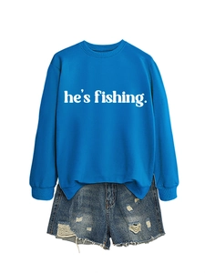 Flat lay of a bright blue crewneck sweatshirt and distressed denim shorts outfit set