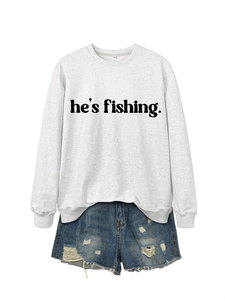 Detail of light gray crewneck sweatshirt with he's fishing print and distressed denim shorts