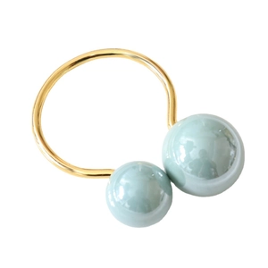 Tiffany blue U-shaped napkin ring with shell pearl accents on a gold metallic base