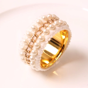 Elegant napkin ring with white crochet lace, small pearls and gold chain detail