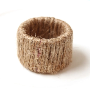 Handcrafted natural jute rope napkin ring with rustic woven texture for hotel dining decor