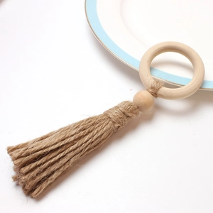 Natural beech wood napkin ring with rustic jute tassel and bead for boho table settings
