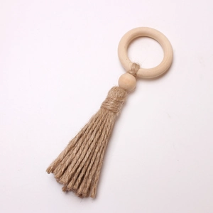 Bohemian beech wood napkin ring with natural jute rope tassel and wooden bead detail