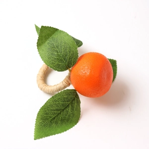 Realistic orange napkin ring with green leaves and a natural woven fiber band on white background