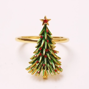 Close-up of a Christmas tree napkin ring with green enamel and red rhinestones